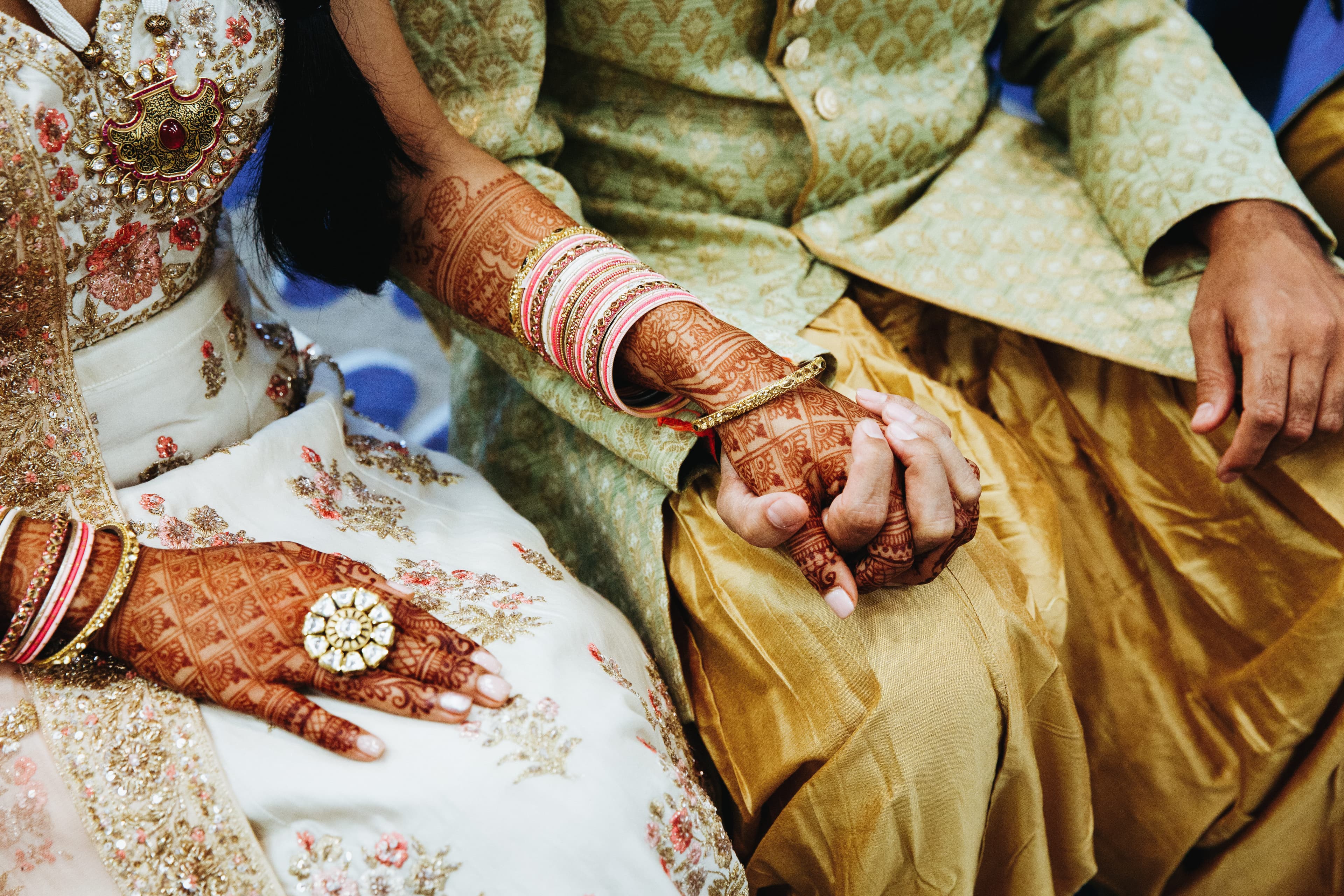 Indian wedding couple holding hands
